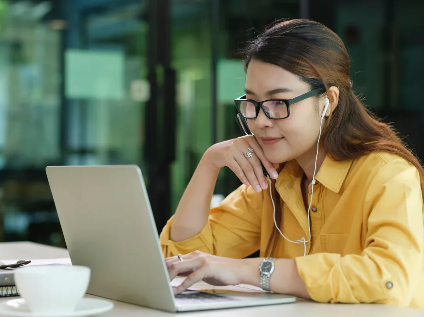 A person working on a laptop computer